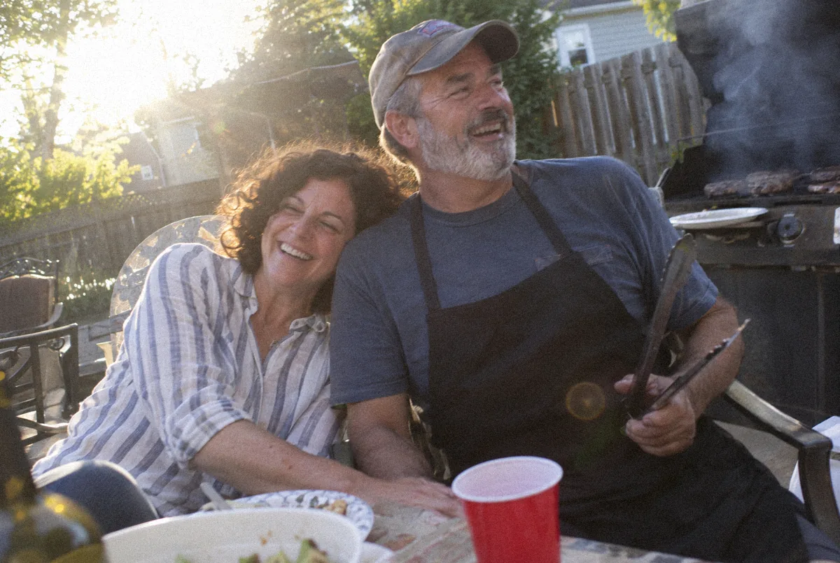 Grace and her brother at a backyard barbecue